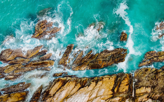 Rocky shore ocean cave sand free wallpaper for desktop - medium preview image