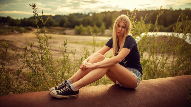 Woman sitting ledge river outdoors free wallpaper for desktop - medium preview image