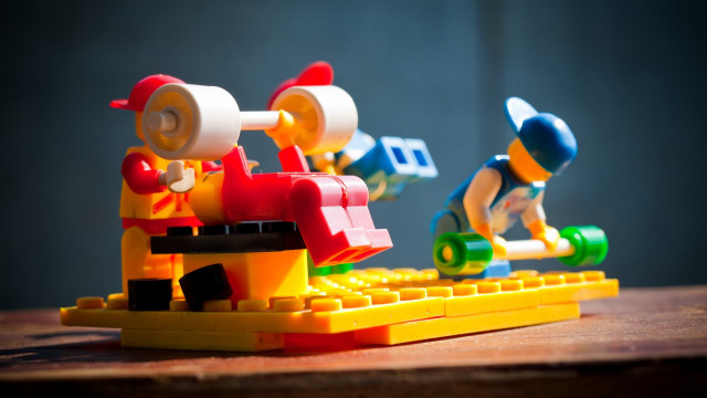 Lego man train tiltshift shallow free wallpaper for desktop - medium preview image