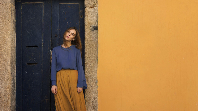 Woman standing door blue shirt free wallpaper for desktop - medium preview image