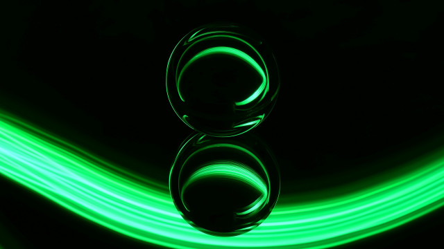 Green light reflection black surface free wallpaper for desktop - medium preview image