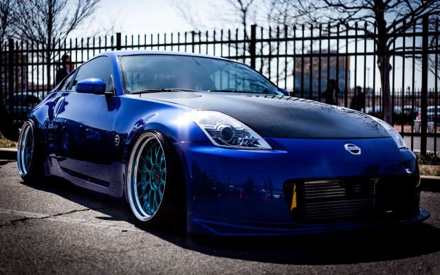 Blue nissan tiltshift snow fence free wallpaper for desktop - medium preview image