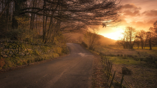 Sunset road fence trees mountains free wallpaper for desktop - medium preview image