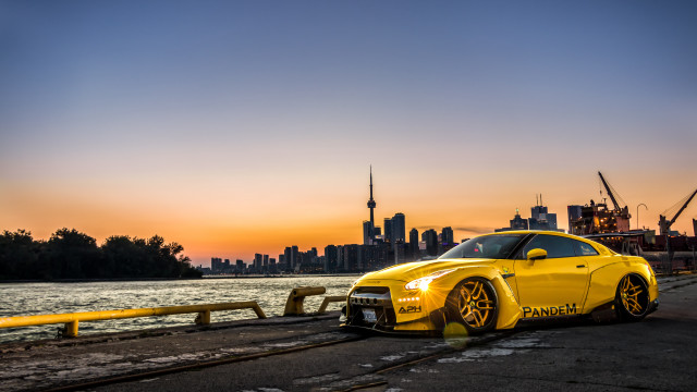 Yellow sports car waterfront city free wallpaper for desktop - medium preview image