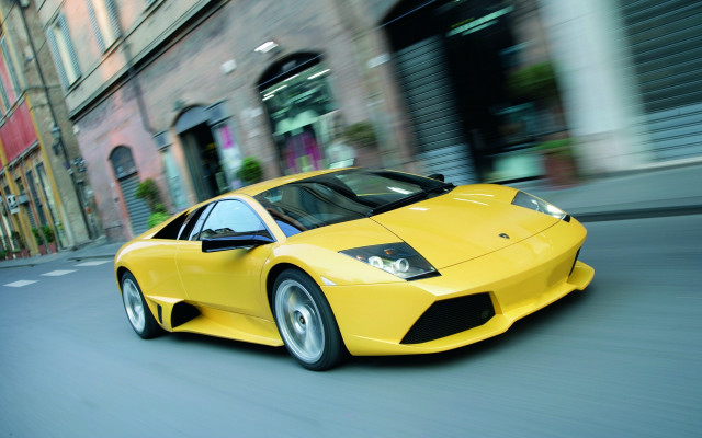 Yellow sports car cityscape rain free wallpaper for desktop - medium preview image