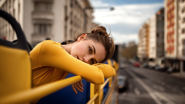 City street woman yellow fence free wallpaper for desktop - medium preview image