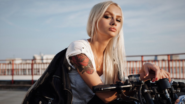 Tattooed woman motorcycle serious gothic free wallpaper for desktop - medium preview image
