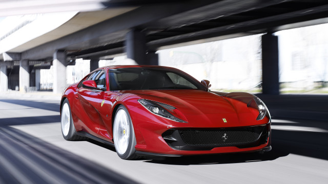 Red sports car driving street #2 free wallpaper for desktop - medium preview image