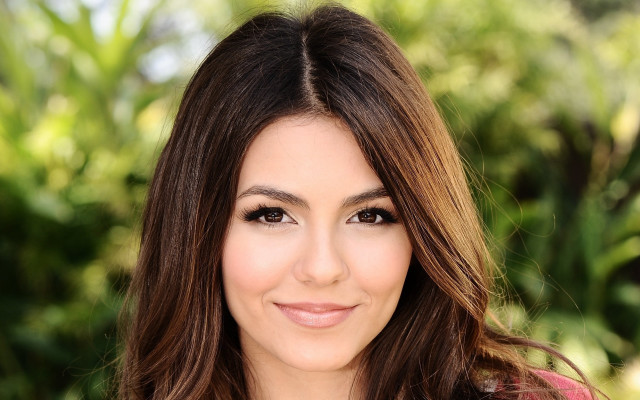 Woman smiling longhair pinkshirt greenbackground free wallpaper for desktop - medium preview image