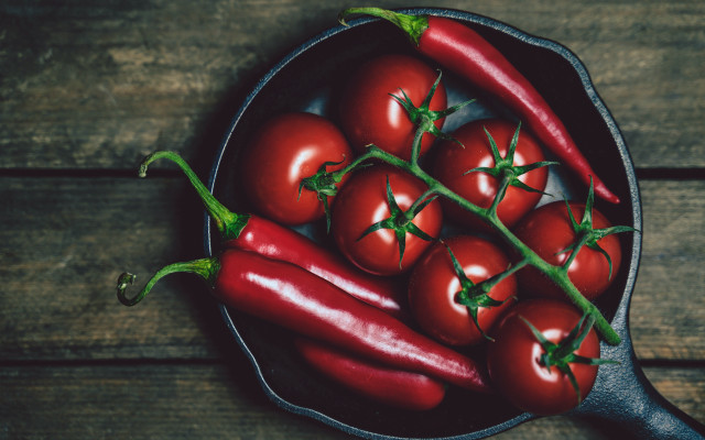 Red peppers pan wooden table free wallpaper for desktop - medium preview image
