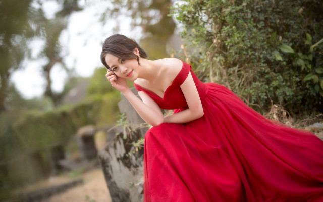 Red dress woman smiling stone free wallpaper for desktop - medium preview image