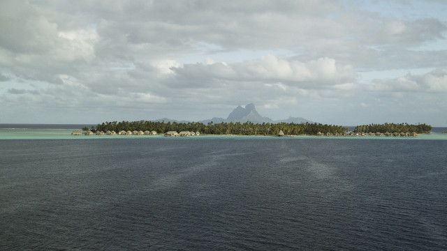 Small island houses mountain ocean free wallpaper for desktop - medium preview image