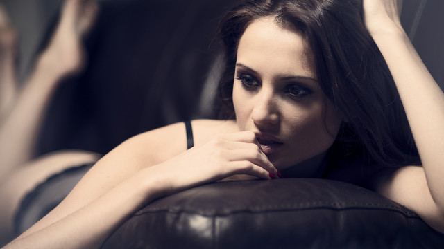 Woman couch portrait blackhair blurry free wallpaper for desktop - medium preview image