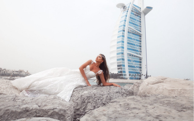 Woman white dress sitting rocks free wallpaper for desktop - medium preview image