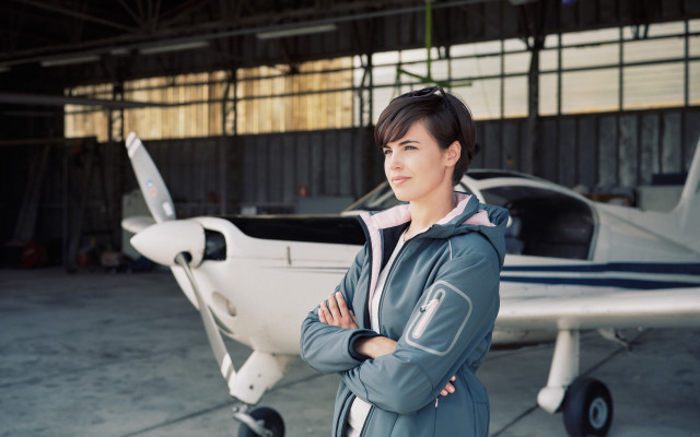 Eve rider woman plane hangar free wallpaper for desktop - medium preview image