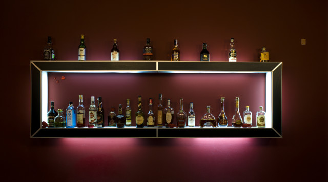 Shelf alcohol bottles red wall free wallpaper for desktop - medium preview image