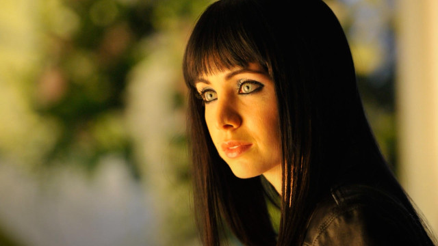 Woman black jacket serious look free wallpaper for desktop - medium preview image