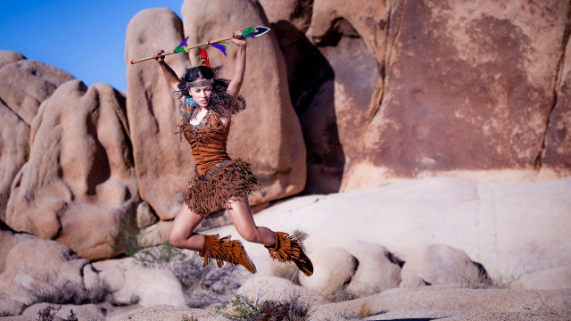 Woman jumping dress rock formation free wallpaper for desktop - medium preview image