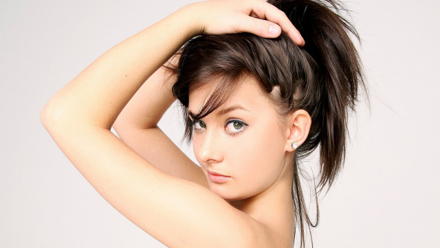 Woman messy topknot posing evaline free wallpaper for desktop - medium preview image