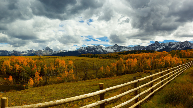 Wooden fence mountains clouds grassy free wallpaper for desktop - medium preview image