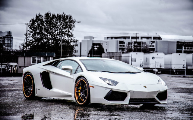 White orange sportscar parkinglot cloudy #2 free wallpaper for desktop - medium preview image