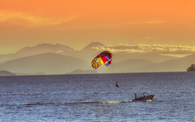 Parasailing ocean mountains sunset dawn free wallpaper for desktop - medium preview image