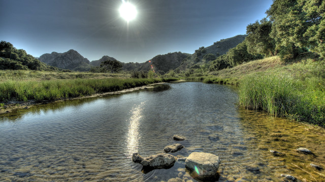 River rocks grass mountains sunlight free wallpaper for desktop - medium preview image