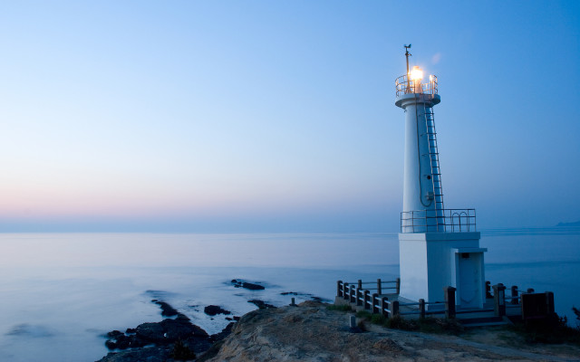 Lighthouse cliff ocean dusk light free wallpaper for desktop - medium preview image