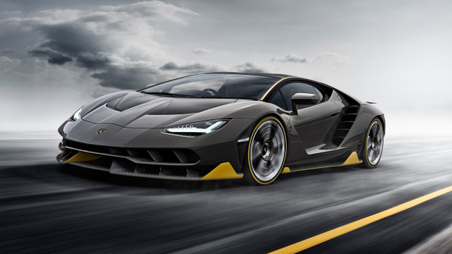 Grey yellow sportscar driving darkclouds free wallpaper for desktop - medium preview image