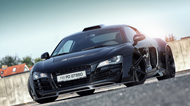 Black sports car driving street free wallpaper for desktop - medium preview image