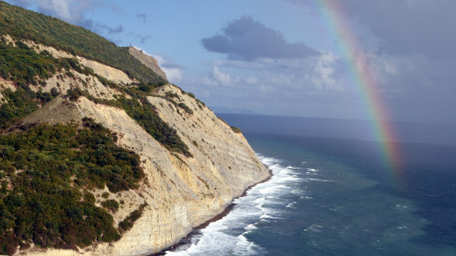 Rainbow ocean cliff beach mountain free wallpaper for desktop - medium preview image