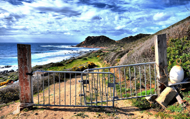 Gated ocean beach rocks cityscape free wallpaper for desktop - medium preview image