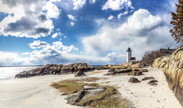 Lighthouse rocky shore cloudy sky free wallpaper for desktop - medium preview image