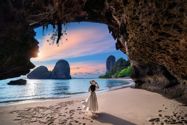 Woman beach cave ocean mountains free wallpaper for desktop - medium preview image