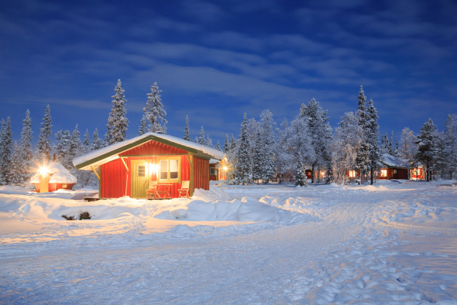 Snowy cabin night forest lights free wallpaper for desktop - medium preview image