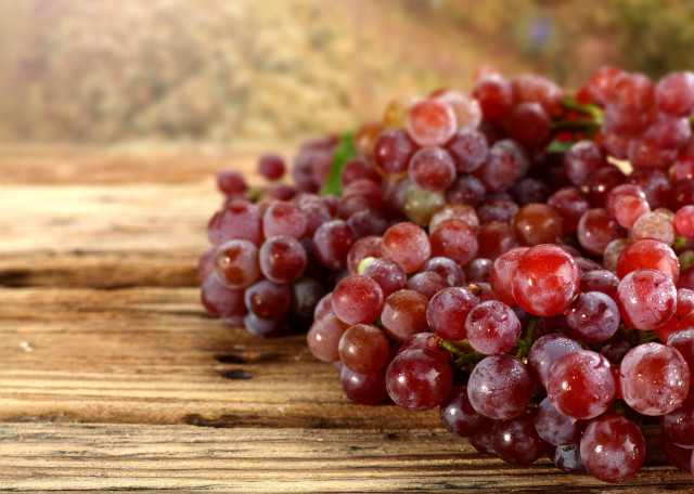 Grapes wooden table blurry background free wallpaper for desktop - medium preview image