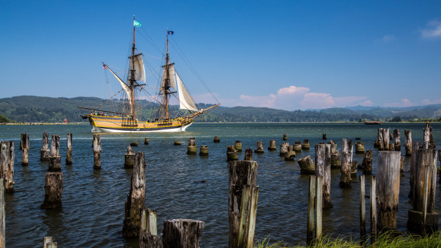 Large boat waterfront pier mountains free wallpaper for desktop - medium preview image