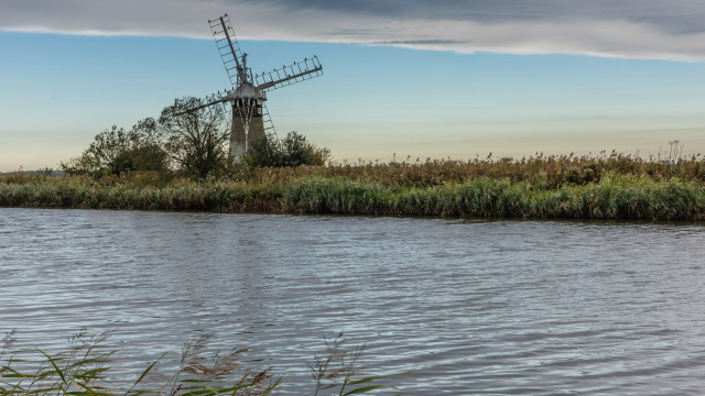 Windmill island river grass clouds free wallpaper for desktop - medium preview image