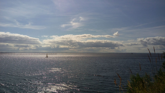 Sailboat cloudy sky lighthouse water free wallpaper for desktop - medium preview image