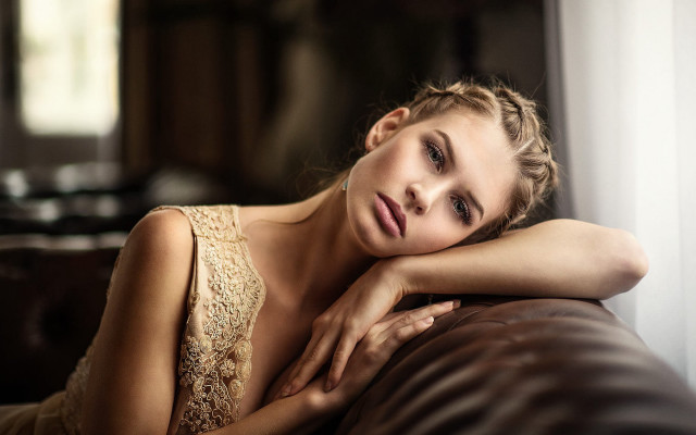 Woman laying leather couch portrait free wallpaper for desktop - medium preview image