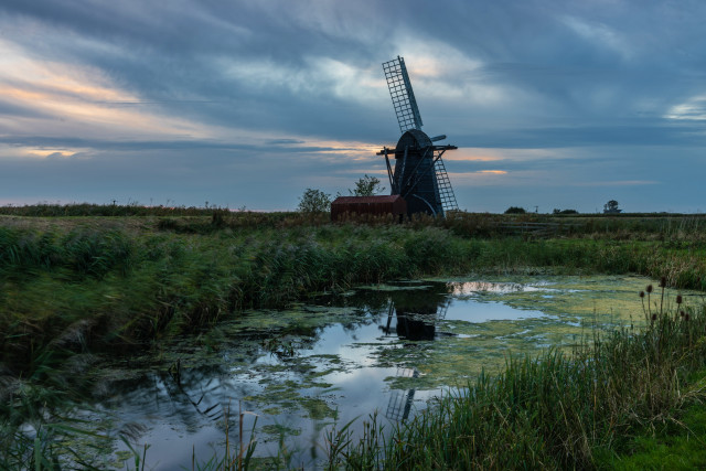 Windmill pond grass cloudy sky free wallpaper for desktop - medium preview image