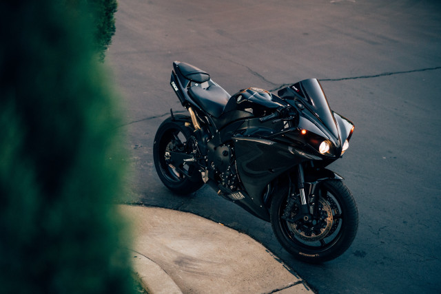 Black motorcycle road bush sidewalk free wallpaper for desktop - medium preview image