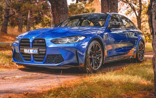 Blue car woods autumn leaves free wallpaper for desktop - medium preview image