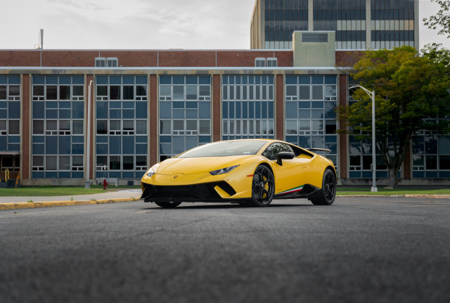 Yellow sports car windowed building free wallpaper for desktop - medium preview image