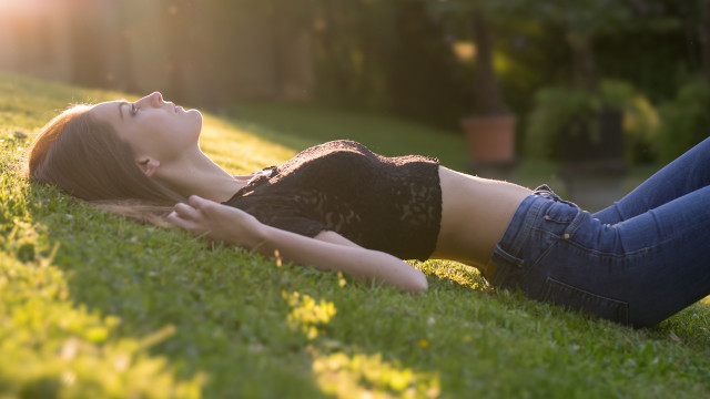 Woman grass park tiltshift blur free wallpaper for desktop - medium preview image