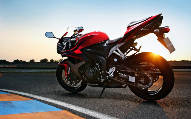 Red motorcycle sunset backlit photorealism free wallpaper for desktop - medium preview image