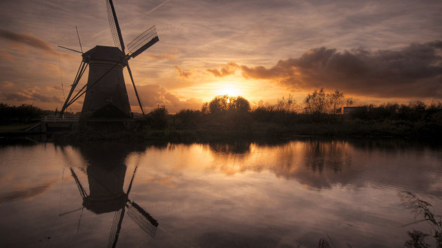 Windmill sunset water cityscape clouds free wallpaper for desktop - medium preview image