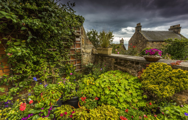 Garden stonewall pottedflowers cloudy sky free wallpaper for desktop - medium preview image
