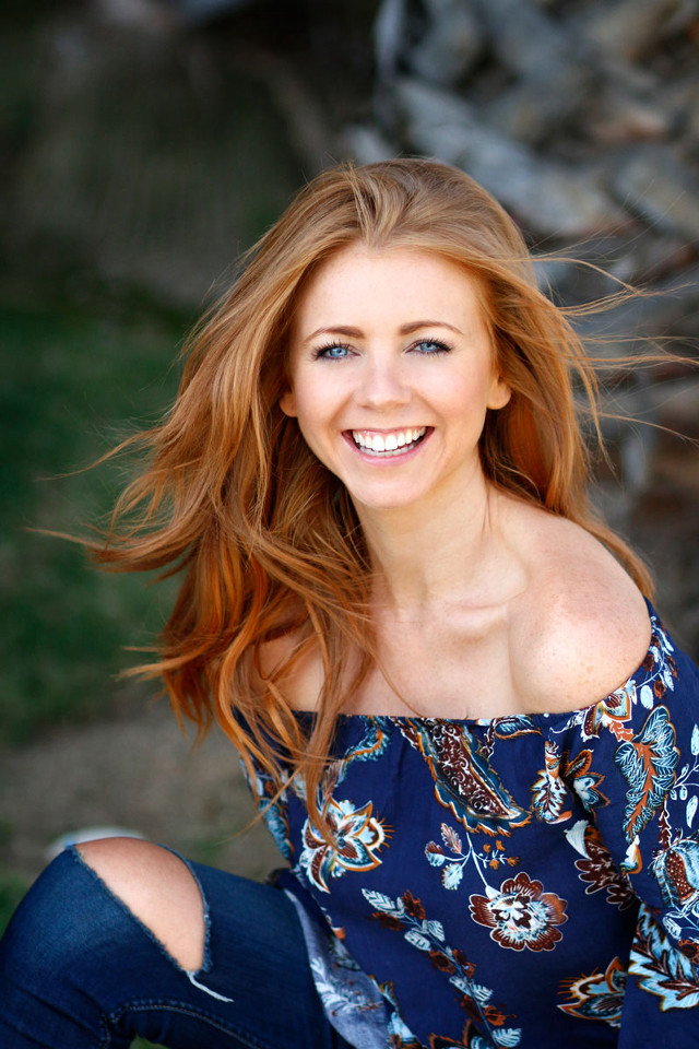 Woman red hair smiling ground free wallpaper for mobile - medium preview image