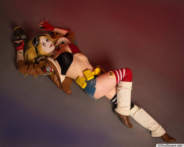 Woman costume laying ground toy free wallpaper for desktop - medium preview image